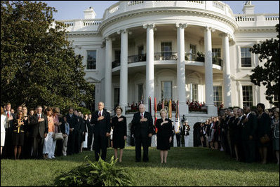 President Bush stands with Laura Bush, Vice President Dick Cheney and Mrs. Cheney as they observe a moment of silence, on the South Lawn, in honor of 9/11 victims September 11, 2005. This marks the fourth anniversary of terrorist attacks on both the World Trade Center and The Pentagon. 