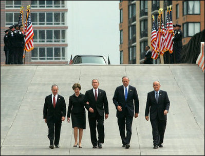 President George W. Bush and Laura Bush walk with New York City Mayor Michael Bloomberg, far left, New York Governor George Pataki, second from right, and former New York City Mayor Rudolph Giuliani down the entrance ramp to Ground Zero at the World Trade Center site in New York City Sunday, Sept. 10, 2006.