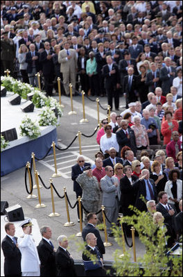 President George W. Bush joined from left by James J. Laychak, chairman of the Pentagon Memorial Fund, Inc., Chairman of the Joint Chiefs of Staff, Admiral Michael Mullen, U.S. Secretary of Defense Robert Gates, and former Secretary of Defense Donald Rumsfeld, stand during the playing of the National Anthem at the dedication ceremony of the 9/11 Pentagon Memorial Thursday, Sept. 11, 2008, at the Pentagon in Arlington, Va.