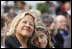A young girl leans close to her mother during the dedication ceremony of the 9/11 Pentagon Memorial Thursday, Sept. 11, 2008, in Arlington, VA.