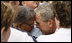 President George W.Bush embraces a family member during the Pentagon Memorial dedication ceremony Thursday, Sept. 11, 2008 at the Pentagon in Arlington, Va., where 184 memorial benches were unveiled honoring all innocent life lost when American Airlines Flight 77 crashed into the Pentagon on Sept. 11, 2001.