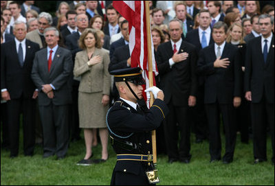 An honor guard presents the American Flag on the South Lawn of the White House Thursday, Sept. 11, 2008, during an observance of the seventh anniversary of the September 11 terrorist attacks.