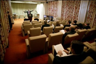 Meeting with staff in the Family Theater of the White House, President George W. Bush rehearses his State of the Union speech Jan. 19, 2004. 