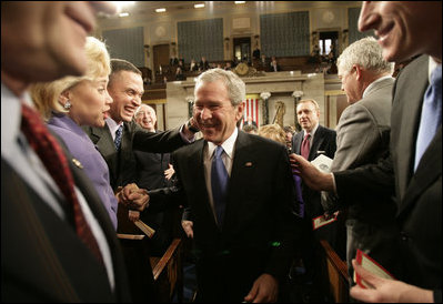 President George W. Bush is congratulated by Tennessee Rep. Harold Ford and Louisiana Sen. Mary Landrieu as he leaves the U.S. House Chamber Tuesday, Jan. 31, 2006, following his State of the Union address.