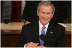 President George W. Bush smiles as he's applauded during Tuesday's 2006 State of the Union address.