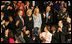 Mrs. Laura Bush applauds the family of Staff Sgt. Dan Clay Tuesday night as they were acknowledged by President George W. Bush during his State of the Union address. Family members of Sgt. Clay, who was killed in Iraq, are his father, Clarence; mother, Sara Jo, and wife, Lisa.