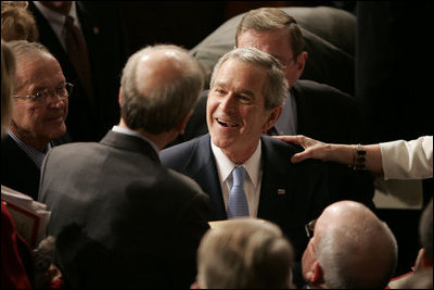 President George W. Bush greets people, shakes hands and signs his autograph after delivering the State of the Union Address in the House Chamber at the U.S. Capitol Tuesday, Jan. 23, 2007.