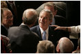 President George W. Bush greets people, shakes hands and signs his autograph after delivering the State of the Union Address in the House Chamber at the U.S. Capitol Tuesday, Jan. 23, 2007.