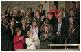 The chamber audience applauds Sgt. Tommy Rieman as the President recognizes him during his State of the Union Address at the U.S. Capitol Jan. 23, 2007. "He was shot in the chest and arm, and received shrapnel wounds to his legs -- yet he refused medical attention, and stayed in the fight. He helped to repel a second attack, firing grenades at the enemy's position,” explained the President. "For his exceptional courage, Sergeant Rieman was awarded the Silver Star. And like so many other Americans who have volunteered to defend us, he has earned the respect and the gratitude of our entire country."