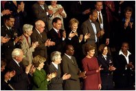 Laura Bush waves as she is applauded during President Bush's State of the Union speech at the U.S. Capitol Tuesday, Jan. 28, 2003. 