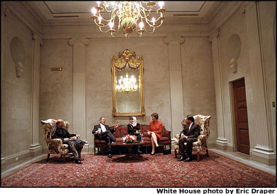 President George W. Bush and Mrs. Bush talk with Hamid Karzai (far left) and Dr. Sima Samar (center) shortly before delivering the State of the Union address to Congress in the United States Capitol Jan. 29. Mr. Karzai is the Chairman of the Afghan Interim Authority, and Ms. Sima Samar directs the newly created Women's Ministry. White House photo by Eric Draper.
