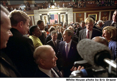 After his address, President Bush stops to talk with Congresswomen and men as he leaves the U.S. Capitol Jan. 29. White House photo by Eric Draper.