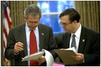President Bush reviews the text with Director of Presidential Speechwriting Michael Gerson in the Oval Office, Jan. 23, 2003. 