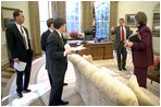 President Bush gives his speechwriting team a few points after revising the State of the Union Address in the Oval Office Jan. 23, 2003. Meeting with the President are, from left, Matthew Scully, John McConnell, Mike Gerson and Advisor Karen Hughes.