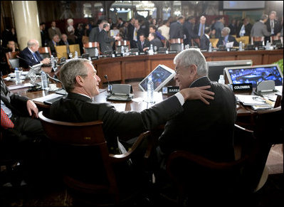 President George W. Bush shares a moment Saturday, Nov. 5, 2005, with President Alfredo Palacio of Ecuador during the final session of the 2005 Summit of the Americas in Mar del Plata, Argentina.