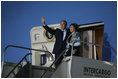 President George W. Bush and Laura Bush wave from Air Force One after landing Thursday, Nov. 3, 2005, in Mar del Plata, Argentina, where the President will participate in the Summit of the Americas. 