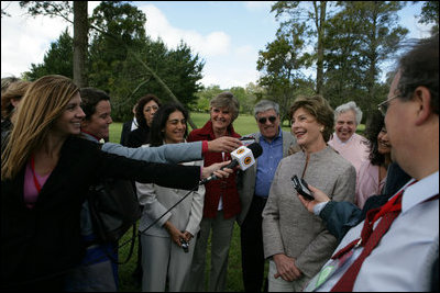 Mrs. Laura Bush smiles as she talks with the media after lunching Friday, Nov. 4, 2005, at Estancia Santa Isabel, an Argentine ranch located not far from Mar del Plata, where President George W. Bush was participating in the 2005 Summit of the Americas. 