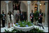 President George W. Bush and Mrs. Bush are welcomed Monday, Nov. 7, 2005, by Panama's President Martin Torrijos and his wife, Vivian, -- and a pet bird -- at the Palacio de Las Garzas in Panama City, Panama. 