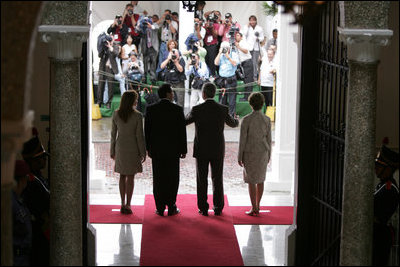 President and Mrs. Bush and President Martin Torrijos of Panama, and Mrs. Torrijos, face the media after the Bush's arrival Monday, Nov. 7, 2005, at the Palacio de Las Garzas in Panama City, Panama. 