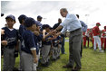 President George W. Bush greets players from the Meron's Academy Little League team in Panama City, Panama, Monday, Nov. 7, 2005. 