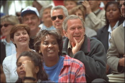 The President and Mrs. Bush watch the action during a tee-ball game on the South Lawn May 6, 2001.