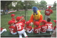 The San Diego Chicken visits the Rockies dugout before the game begins during a tee-ball game on the South Lawn May 6, 2001.
