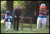 President Bush gave each player a memento of the afternoon during a tee-ball game on the South Lawn May 6, 2001.