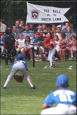 A batter hits on the ball on the South Lawn of the White House Sunday, June 3, 2001.