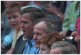 President Bush, Laura Bush, former President George Bush and the President's brother, Governor Jeb Bush, cheer on the players during the second Tee Ball game on the South Lawn on Sunday, June 3, 2001.