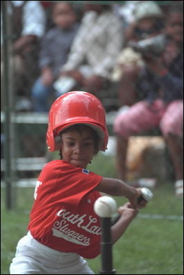 A player swings during the second Tee Ball game on the South Lawn on Sunday, June 3, 2001.