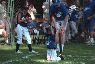 Rounding bases amid cheers and applause, coming home is always a cause for celebration during the third Tee Ball game on the South Lawn on Sunday, July 15, 2001.