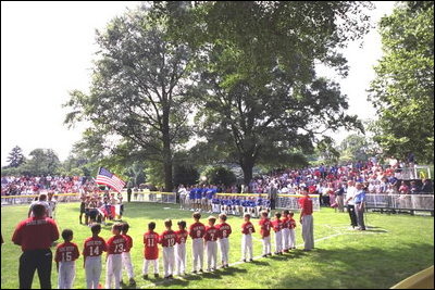 President George W. Bush attends a Tee Ball on the South Lawn game between the Cardinals and the South Berkeley Little League Braves from Inwood, West Virginia. June 23, 2002.