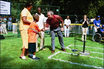 President George W. Bush hosts Tee Ball on the South Lawn with The Oriole Advocates Challengers of Marley Area Little League of Glen Burnie, Maryland and The Ridley Police Challengers of Leedom Little League, Ridley Park, Pennsylvania, July 27, 2003.