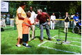 President George W. Bush hosts Tee Ball on the South Lawn with The Oriole Advocates Challengers of Marley Area Little League of Glen Burnie, Maryland and The Ridley Police Challengers of Leedom Little League, Ridley Park, Pennsylvania, July 27, 2003.