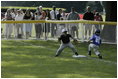 The first basemen from the Hamilton Little Lads Cal Ripken League of Hamilton, N.J., makes a play during a fast-paced game against the Milwood Little League of Kalamazoo, Mich., during the last game of the 2003 White House South Lawn Tee Ball season Sunday, Sept. 7, 2003.