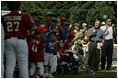 President George W. Bush welcomes players and their family members from the West University Little League Challengers from Houston, Texas, and the District 12 Little League Challengers from Williamsport, Pa., Sunday, July 24, 2005, at a Tee Ball game on the South Lawn of the White House.