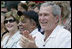 President George W. Bush and Laura Bush are joined by baseball legend and hall of famer Willie Mays, Tee Ball Commissioner for the day Sunday, July 30, 2006, at the Tee Ball on the South Lawn game between the Thurmont Little League Civitan Club of Frederick Challengers of Thurmont, Md., and the Shady Spring Little League Challenger Braves of Shady Spring, W. Va.