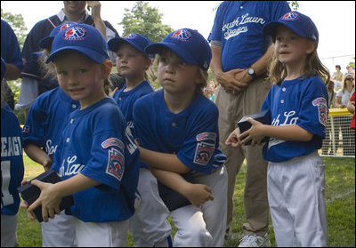 Members of the Cumberland, Maryland Bobcats look on during the presentation of game balls Wednesday, June 27, 2007, after their opening game of the 2007 White House Tee Ball season against the Luray, Virginia Red Wings on the South Lawn. 
