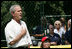President George W. Bush is joined for the singing of the national anthem by Meredith Cripe, a member of the Chantilly, Virginia Little League Challenger League, at the top of the first White House Tee Ball Game of the 2007 season. The game pitted the Bobcats from Cumberland, Maryland, against the Red Wings of Luray, Virginia.