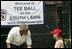 Under the watchful eye of Meredith Cripe, a member of the Chantilly, Virginia Little League Challenger League, President George W. Bush places a ball on the tee to start the game and the 2007 White House Tee Ball Season on the South Lawn. The game pitted the Bobcats from Cumberland, Maryland, against the Red Wings of Luray, Virginia. 