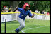 A player from the Inner City Little League of Brooklyn, N.Y. runs for first base after his hit against the Wrigley Little League Dodgers of Los Angeles Sunday, July 15, 2007 at the White House Tee Ball Game, in honor of legendary baseball player Jackie Robinson.