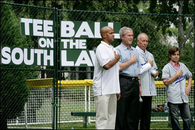President George W. Bush is joined during the playing of the National Anthem by Roberto Clemente Jr., left, son of Hall of Famer Roberto Clemente; Angel Macias, who in 1957 became the only player to pitch a perfect game in Little League World Series history, and actor Jake T. Austin, right, who will portray Macias in an upcoming film about that game, seen together Monday, June 30, 2008, at Tee Ball on the South Lawn at the White House.