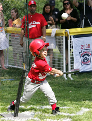 A player for the Cramer Hill Little League Rex Sox of Camden, N.J. hits the ball during the season opening game of the 2008 Tee Ball on the South Lawn Monday, June 30, 2008, on the South Lawn of the White House playing against the Jose M. Rodriguez Little League Angels of Manatí, Puerto Rico.