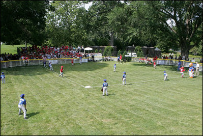 A view from the outfield on the South Lawn of the White House shows the opening game of the the 2008 Tee Ball season in action Monday, June 30, 2008, between the Cramer Hill Little league Red Sox of Camden, N.J., and the Jose M. Rodriguez Little League Angels of Manatí, Puerto Rico.