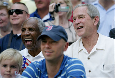  President George W. Bush and baseball Hall of Famer Frank Robinson, left, cheer on players participating in the Tee Ball on the South Lawn All-Star Game Wednesday, July 16, 2008, where the teams Eastern U.S. vs.Central U.S., and Southern U.S. vs. Western U.S., played in an afternoon doubleheader at the White House.