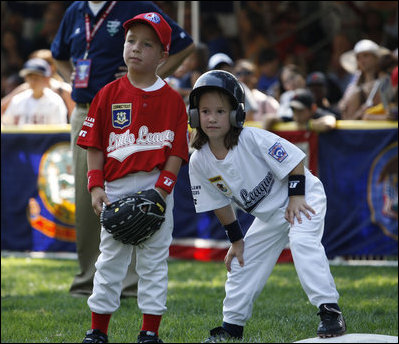  Kelsey Brauer of the Central U.S. Tee Ball All-Stars leans into first baseman Connor Hogan of the Eastern U.S. All-Stars after reaching first Wednesday, July 16, 2008, during the first game of an All-Star Tee Ball doubleheader on the South Lawn of the White House.