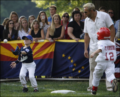  John Cloer, age 7, from Sierra Madre, Calif., makes the catch as West Virginia's Brody Kehrer, age 5, races to beat him to the base during All-Star tee ball action on the White House South Lawn on July 16, 2008. One child represented each state and the District of Columbia and teams were divided into four regions with California, represented on the Western team and West Virginia in the Southern team.