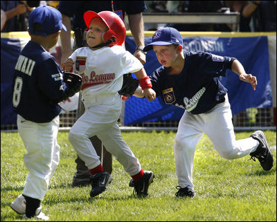  Reggie Graff, right, age 6, from St. George, Utah, tags North Carolina's Avery Shane, age 5, center, as Hawaii's Joshua Miyazawa, age 5, watches during All-Star tee ball action on July 16, 2008 on the South Lawn of the White House. Shane, from Rutherfordton, N.C., was on the Southern team and Graff and Miyazawa, from Honolulu were on the Western team. Two other teams, representing the Central and Eastern sections of the country, played and one child represented each state. President George W. Bush and Mrs. Laura Bush watched the action from a bleachers set up on the grounds for the kids' families.