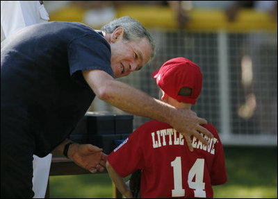  President George W. Bush presents a game ball to Stripes player Adam Plante, 6, of Burke, Va., folllowing the Tee Ball on the Sotuh Lawn: A Salute to the Troops game Sunday, Sept. 7, 2008, played by the children of active-duty military personnel.