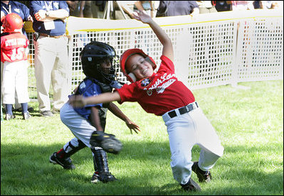  The Stars catcher reaches to tag out a Stripes player during home plate action at the Tee Ball on the South Lawn: A Salute to the Troops game Sunday, Sept. 7, 2008 at the White House, played by the children of active-duty military personnel.